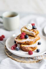 French cinnamon toast with blueberries, raspberries, sugar and coffee. Morning breakfast. French breakfast. 
