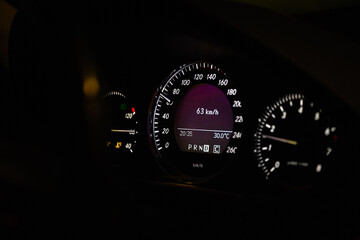 Close-up of dashboard lights of a car at night