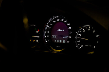 Close-up of dashboard lights of a car at night