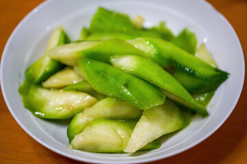 A plate of light and fresh Chinese home cooking, stir-fried loofah