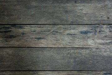 The surface of the old wooden planks is tiled together
