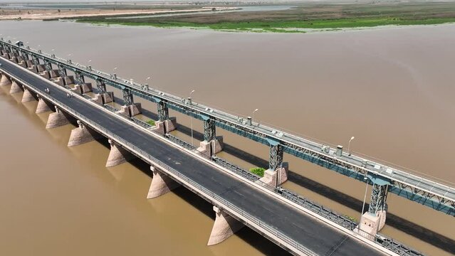 Aerial drone shot of bride above indus river in pakistan.