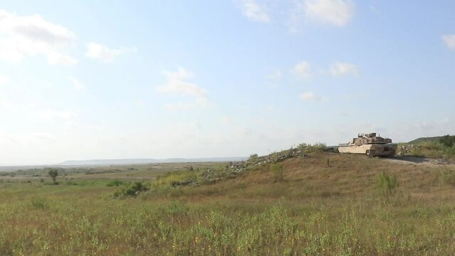 M1A1 Abrams military Tank Stationary, Firing wide view