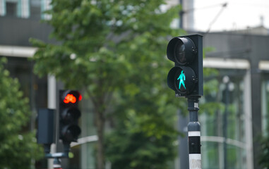 Pedestrian traffic sign. The green light is showing that pedestrians are allowed to cross the...