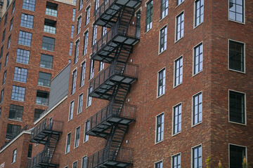 Apartment residential building with a vintage look because of the metal emergency stairs placed...