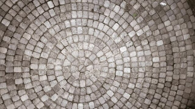 Concrete Old Dominion Paver Circle. Aerial shot looking down at circular brick pathway and seating area in park.