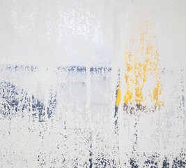 Frosted glass problem or failing. Dissolving privacy fence from age and exposure between two balconies or patio. Abstract grunge texture or surface. Selective focus on semi-transparent frosted glass.
