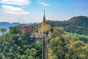 Fotobehang Aerial view of Wat Phra Phutthabat Tak Pha temple on top of the mountain in Lamphun, Thailand © pierrick