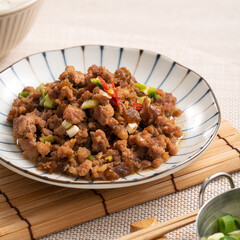 Taiwanese fried minced pork with pickled cucumber on rice named GUA ZI ROU FAN.