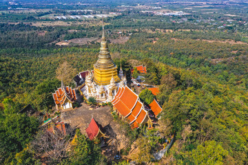 Aerial view of Wat Phra Phutthabat Tak Pha temple on top of the mountain in Lamphun, Thailand