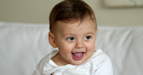 Fototapeta premium Cute baby infant boy portrait face smiling. Adorable beautiful sweet toddler child