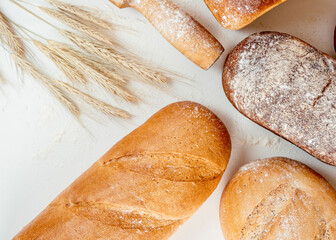4 loafs of bread on white table