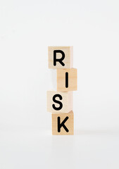 Cubic wooden blocks forming the 'risk' text