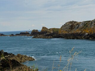 La pointe du Groin, France - August 2018 : Hike around the pointe du Groin in Brittany with the passage of a beautiful sailboat in the English Channel