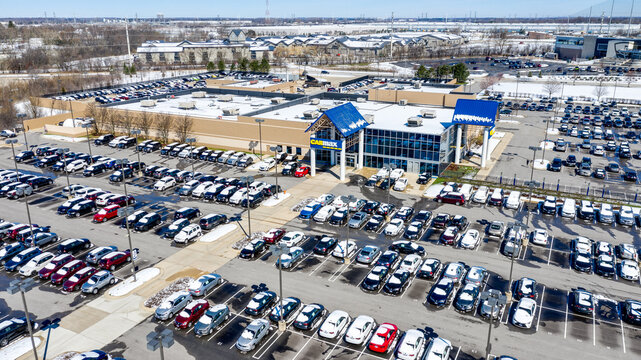 NAPERVILLE, IL, USA - APRIL 15, 2019: CarMax is one of the largest car dealership chains in the country, created in 1993, with over 200 stores nationwide. Drone / aerial view.