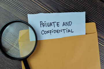 Private and Confidential text on document above brown envelope and stethoscope. Healthcare or...