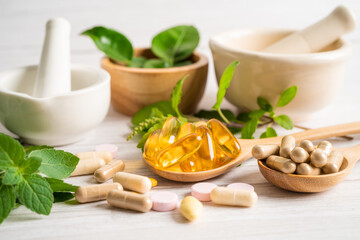 Alternative medicine herbal organic capsule drug with herbs leaf natural supplements for healthy good life.
