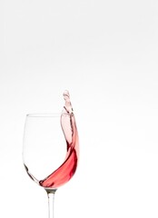 Splash of rose wine on a white background