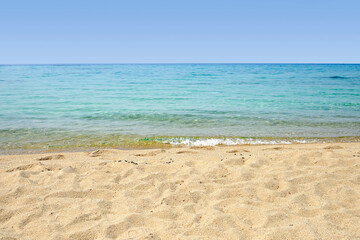 Fototapeta na wymiar empty beach with blue calm sea and sky