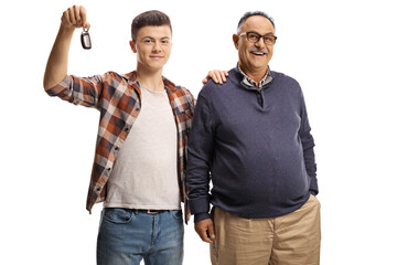 Guy holding car key and holding an elderly man on the shoulder