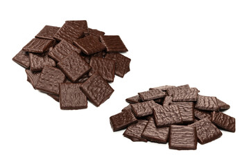 Dark chocolate candies isolated on white background.