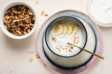 Granola with yogurt and bananas.