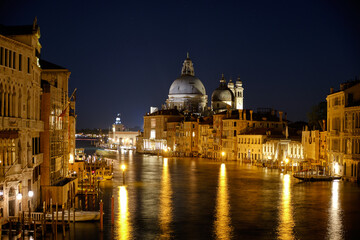 Fototapeta na wymiar Night view of Santa Maria della Salute Church from the Accademia Bridge, Venice, Italy