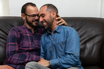 Obraz premium Real couple of Latin American men smile and feel in love. Concept of sexual diversity