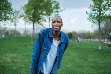 Fototapeta premium Portrait of young man with distinctive features in the park