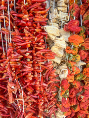 dried red peppers hanged in market