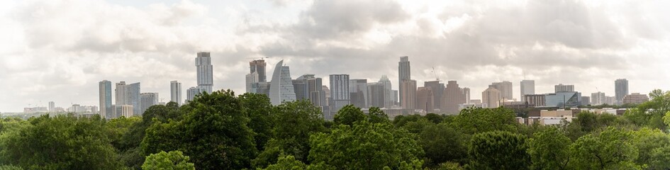Fototapeta na wymiar Aerial View of Downtown Austin With Cloudy Skies From the Suburbs