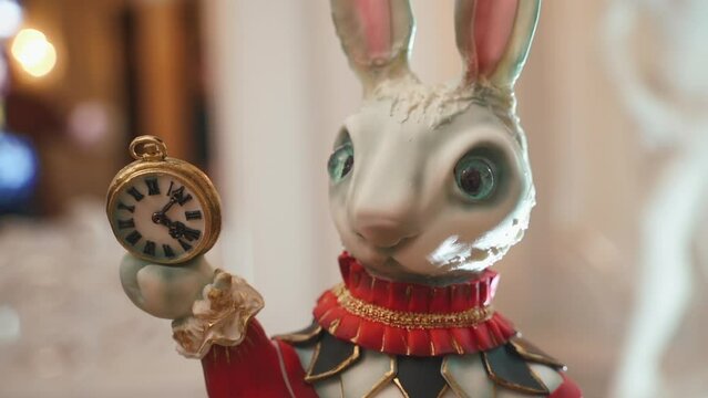 Move around Decorative composition, a festive decoration for Easter. Decorative figure of the rabbit with clock in hands. Alice in wonderland concept. nice and kind. High quality FullHD footage