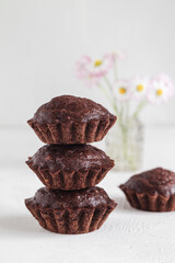 Stack of healthy homemade chocolate muffins. Gluten free banana muffins. Healthy dessert concept.