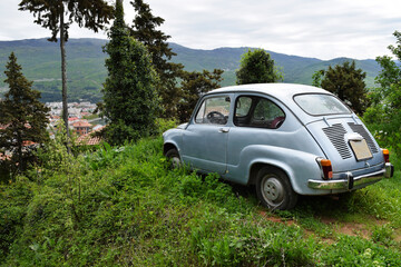 An old Yugoslav-made Citroen stands on an elephant mountain overlooking Lake Ohrid, North Macedonia