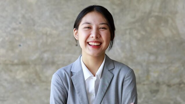 Close-up of smiling Asian beautiful woman, smiling Asian businesswoman happily looking at camera businesswoman portrait business beautiful modern manager pretty slow motion, 4k.