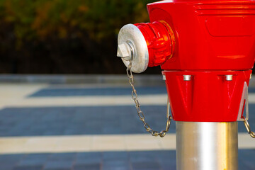 red fire hydrant on the sidewalk in the city