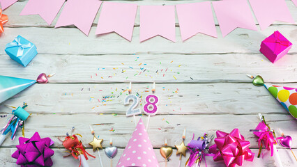 Happy birthday number 28. Copyspace. Beautiful card in pastel pink colors for a woman or a girl....