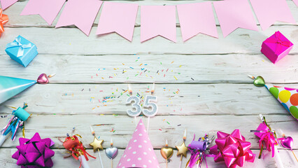 Happy birthday number 35. Copyspace. Beautiful card in pastel pink colors for a woman or a girl....