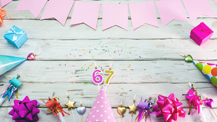 Happy birthday number 67. Copyspace. Beautiful card in pastel pink colors for a woman or a girl....