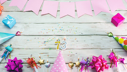 Happy birthday number 73. Copyspace. Beautiful card in pastel pink colors for a woman or a girl....