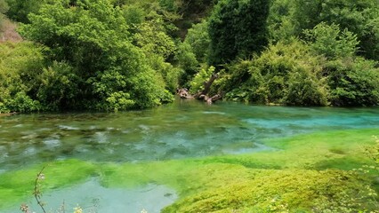 Beautiful turquoise spring Blue Eye or Syri i Kalter near Muzine town in Albania
