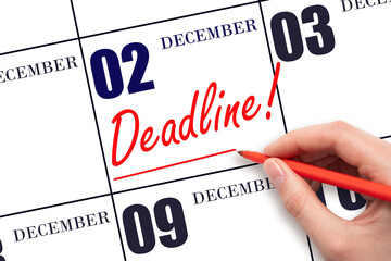 Hand drawing red line and writing the text Deadline on calendar date December 2. Deadline word written on calendar