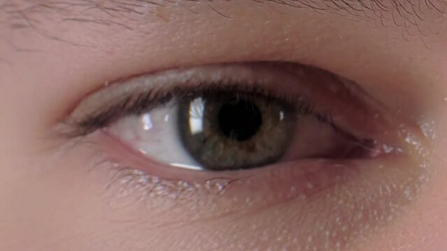 Extreme closeup blinking human eye multicolored pixel glitch effect connection damage bad signal