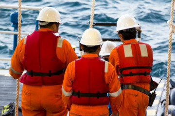 Rig workers are transported on a vessel to offshore rigs in The South China Sea, Brunei. A swing...