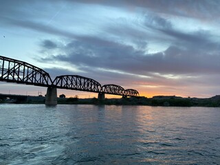 Fototapeta na wymiar River Bridge at Sunset