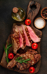 Obraz na płótnie Canvas grilled beef steak on stone background