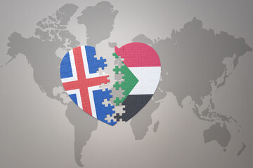 puzzle heart with the national flag of sudan and iceland on a world map background. Concept.