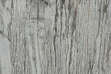 gray white texture from a piece of dirty glass with a pattern