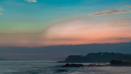 Obraz premium Sunset on the ocean in pastel colors