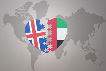 puzzle heart with the national flag of united arab emirates and iceland on a world map background. Concept.